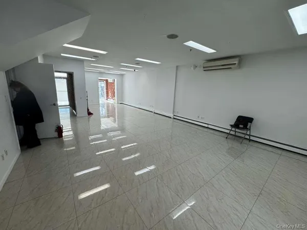 a view of a room with gym equipment and a walk in closet