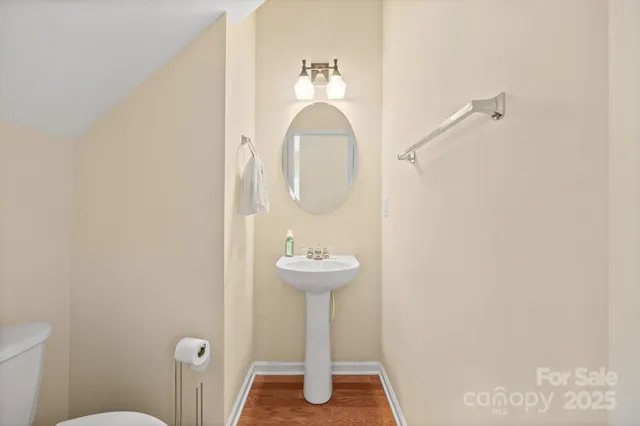 a bathroom with a sink a mirror and a toilet