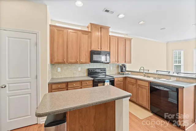 a kitchen with a stove and a refrigerator