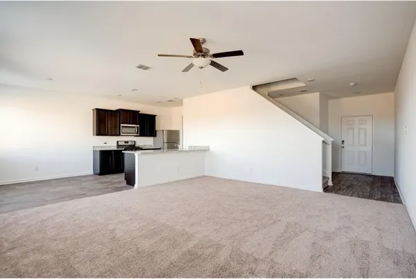 a view of empty room with a flat screen tv