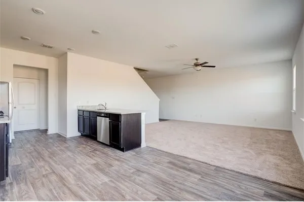 a view of a livingroom with wooden floor