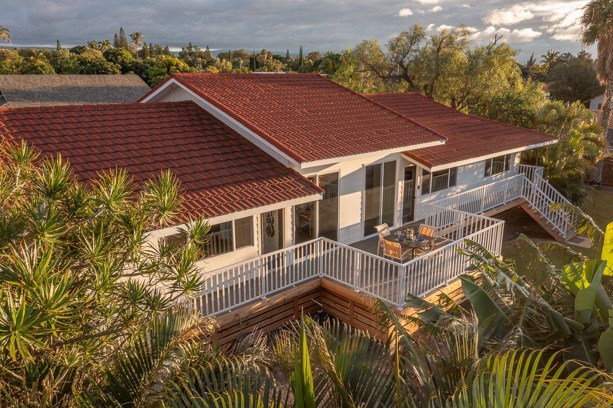 a aerial view of a house with a yard