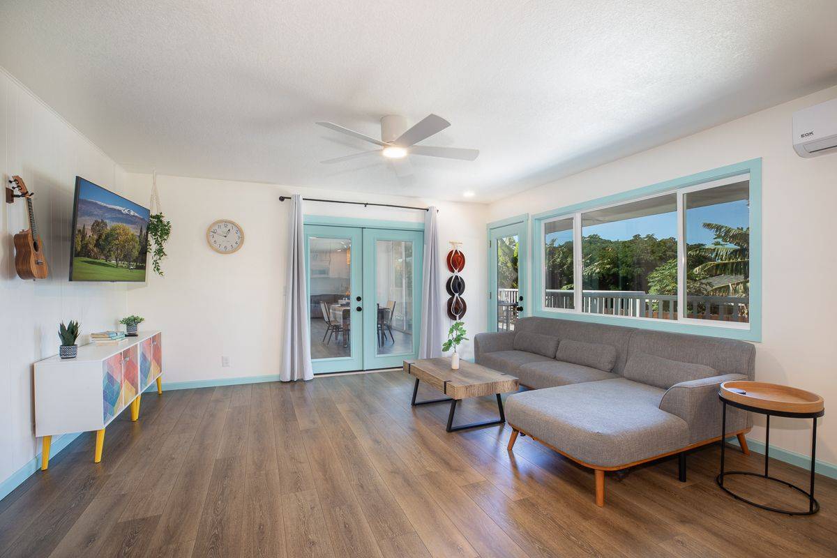 68-1788 Auhili Loop Waikoloa, HI 96738 - Photo 13 of 29 a living room with furniture and a flat screen tv