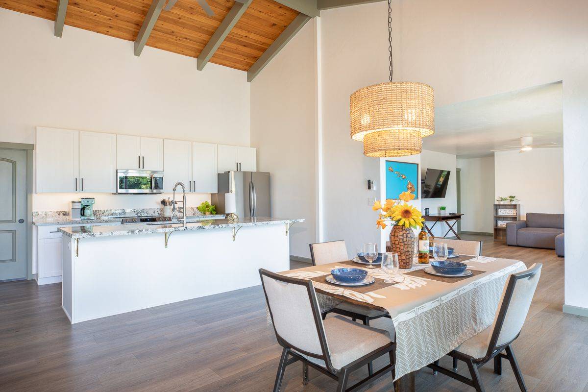 68-1788 Auhili Loop Waikoloa, HI 96738 - Photo 18 of 29 a kitchen with a table and chairs in it