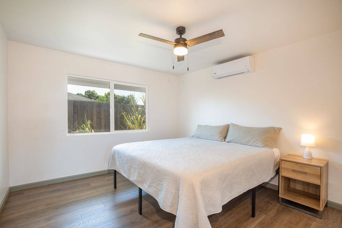 68-1788 Auhili Loop Waikoloa, HI 96738 - Photo 22 of 29 a bedroom with a bed and a window