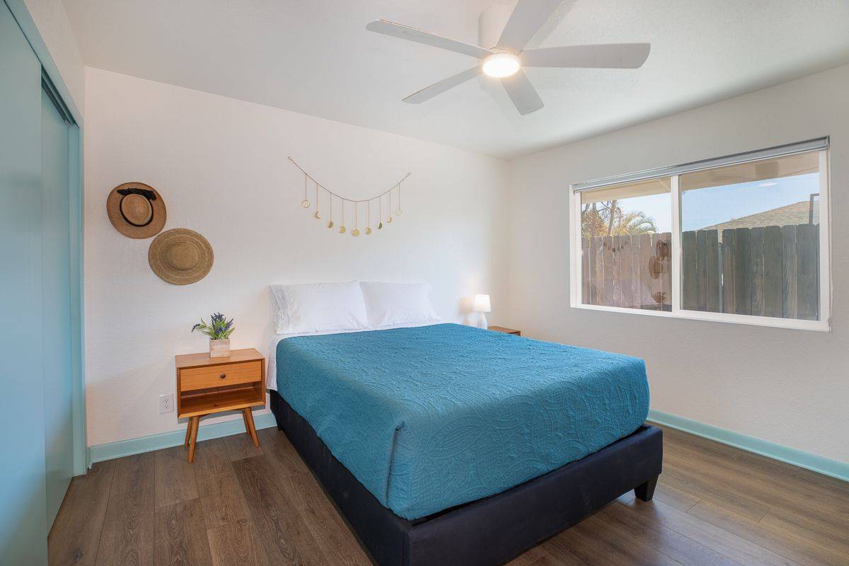 68-1788 Auhili Loop Waikoloa, HI 96738 - Photo 23 of 29 a bedroom with a bed and a window