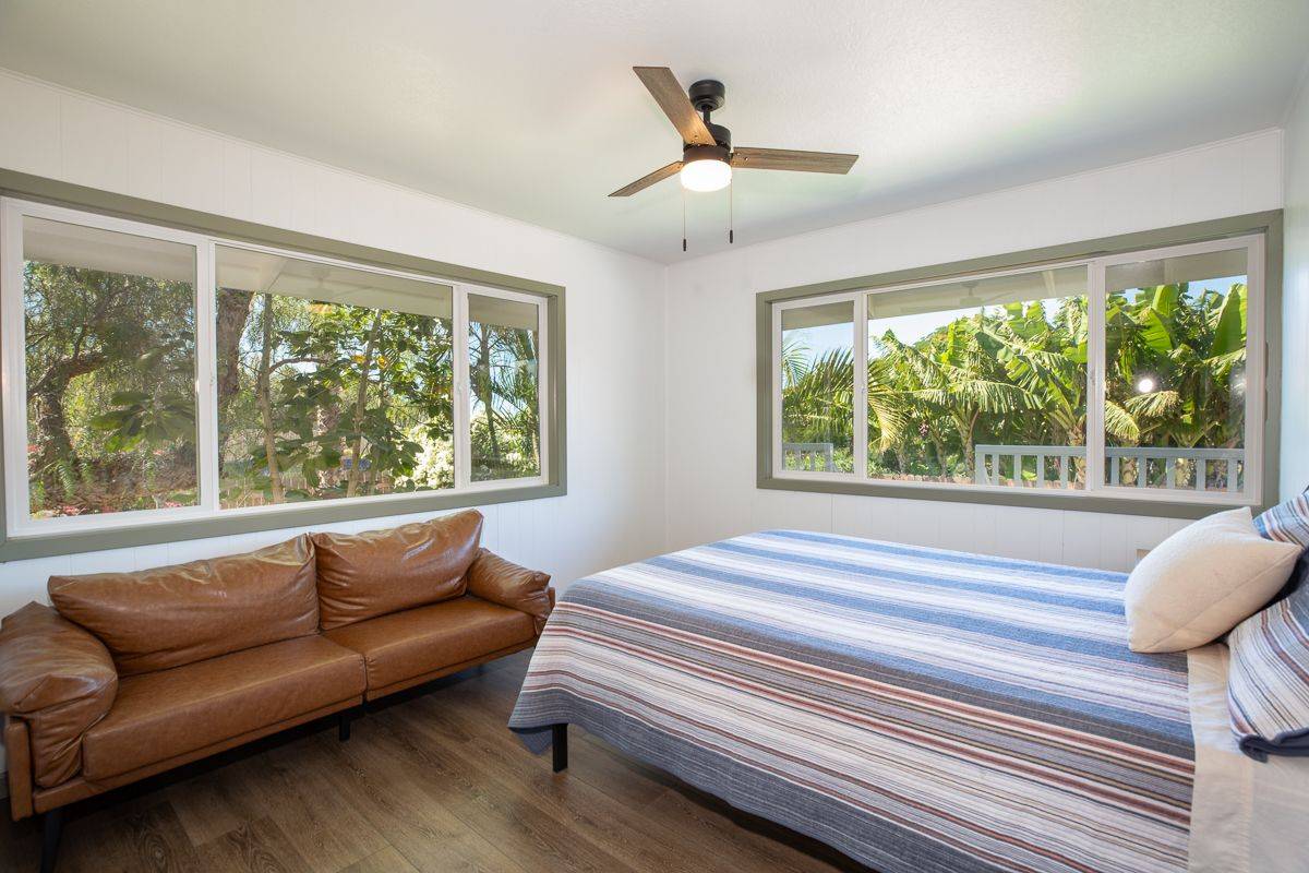 68-1788 Auhili Loop Waikoloa, HI 96738 - Photo 24 of 29 a living room with furniture and a large window