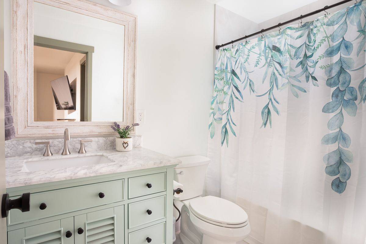 68-1788 Auhili Loop Waikoloa, HI 96738 - Photo 26 of 29 a bathroom with a granite countertop sink a toilet and a mirror