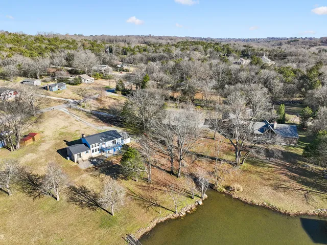 an aerial view of residential house with beach