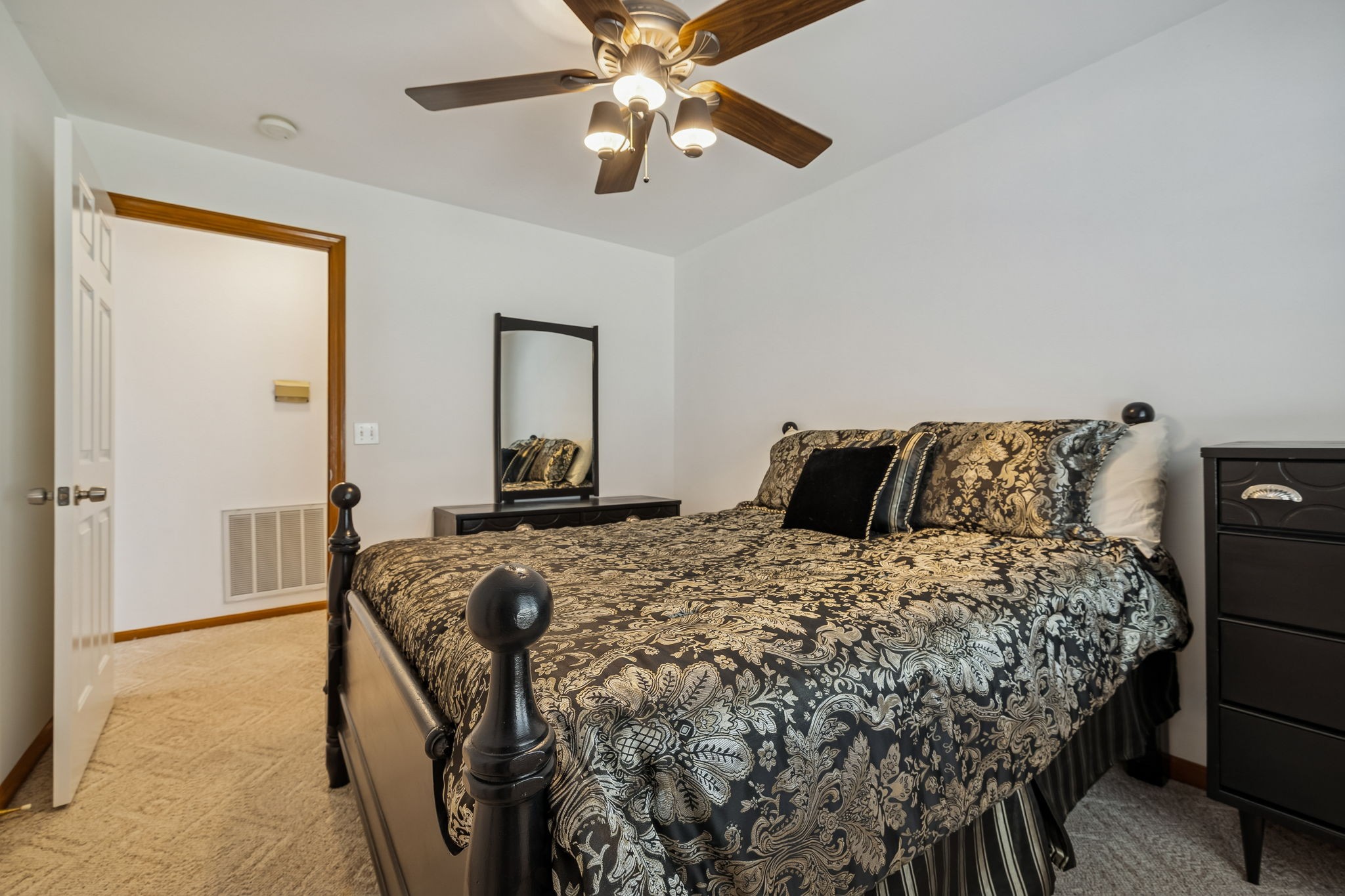 1795 Needmore Road Old Hickory, TN 37138 - Photo 28 of 56 a bed sitting in a bedroom next to a window and a chandelier