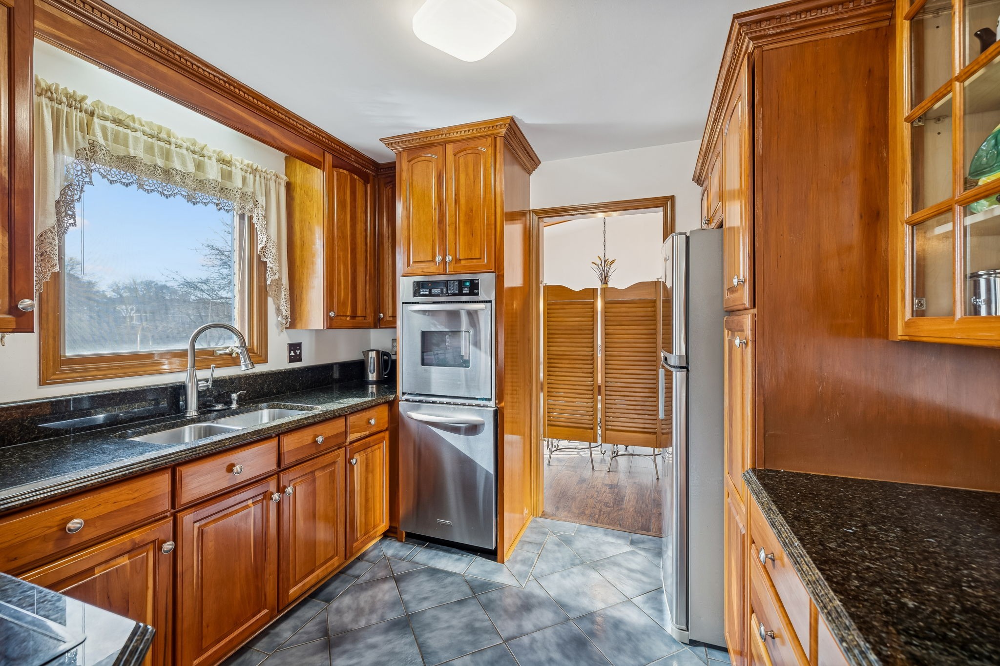 1795 Needmore Road Old Hickory, TN 37138 - Photo 8 of 56 a bathroom with a granite countertop sink a mirror and shower