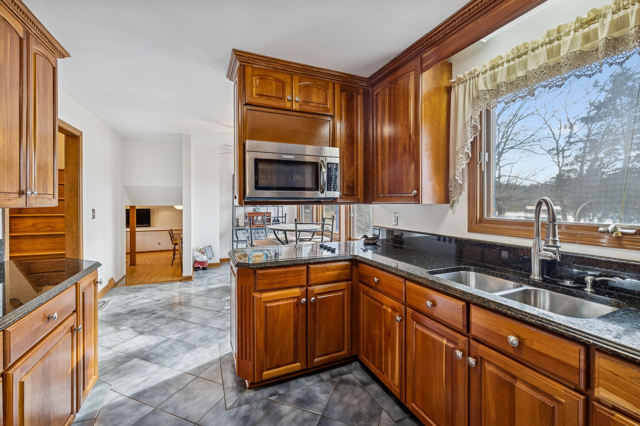 1795 Needmore Road Old Hickory, TN 37138 - Photo 9 of 56 a kitchen with granite countertop a sink and a stove top oven