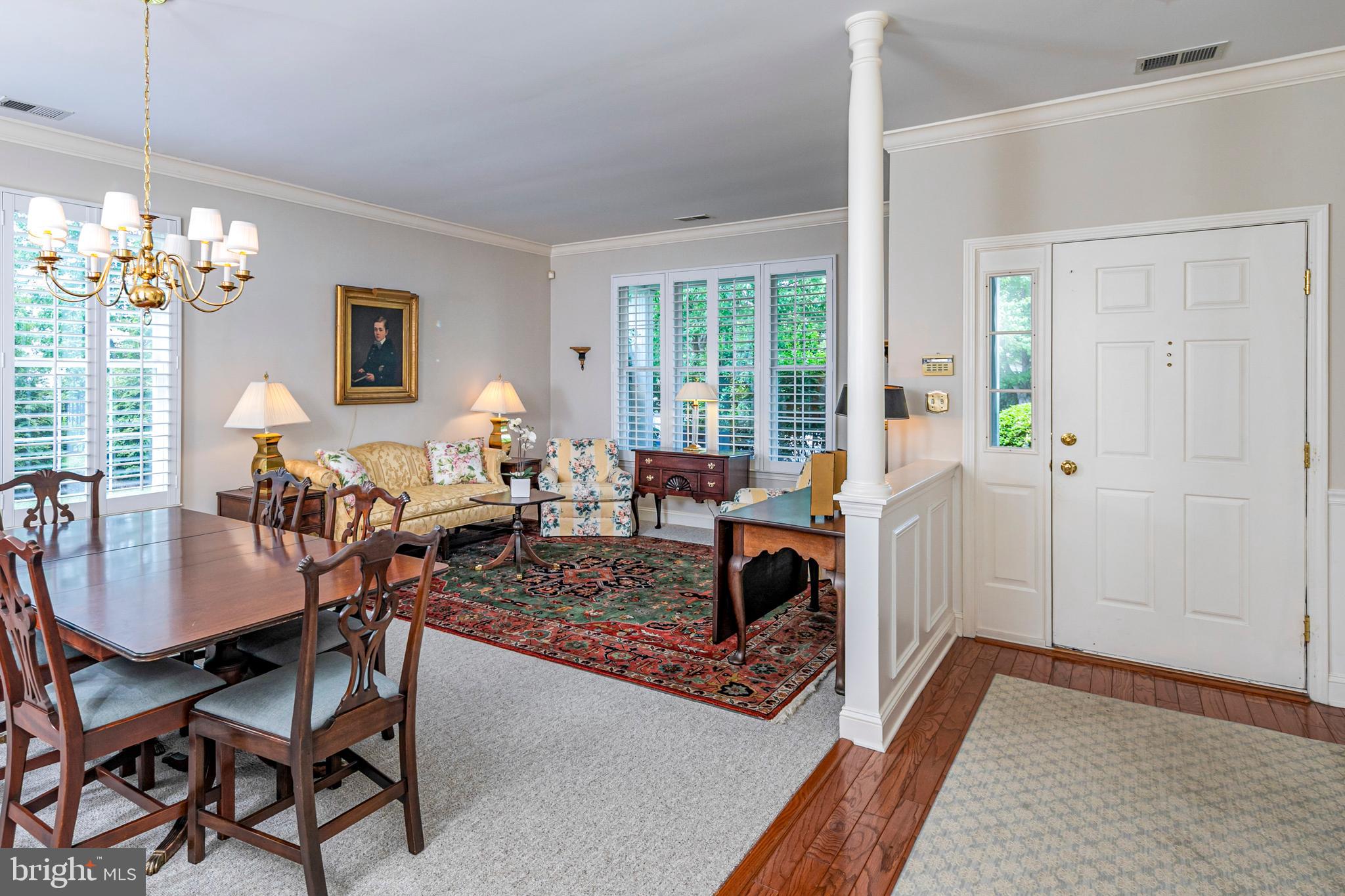 24 Foster Road Pennington, NJ 08534 - Photo 3 of 38 a living room with furniture and a chandelier