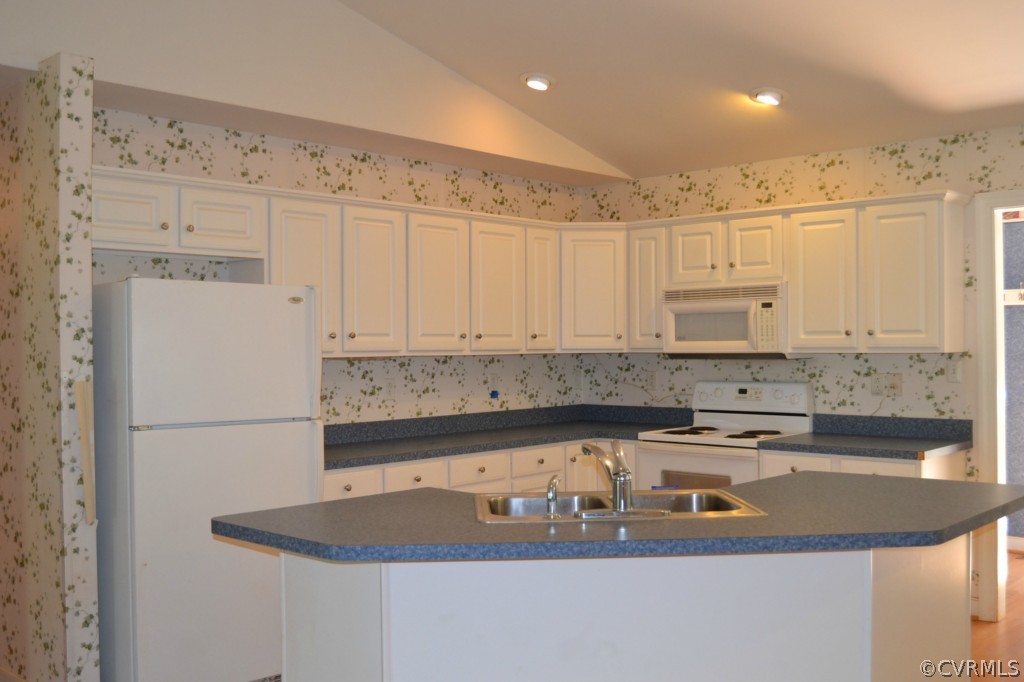 2323 Waltons Store Road Louisa, VA 23093 - Photo 4 of 16 a kitchen with stainless steel appliances granite countertop a sink a stove and a refrigerator