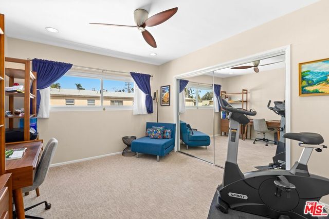 a room with gym equipment and a table