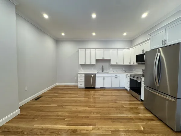 a view of kitchen kitchen microwave and cabinets