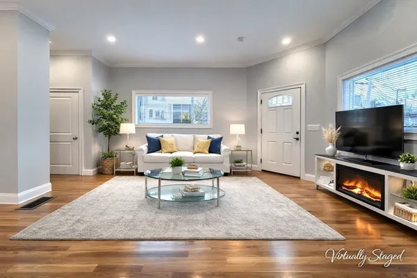 a living room with furniture and a flat screen tv