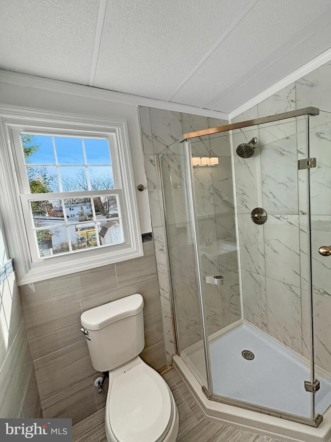 705 2nd Street Delanco, NJ 08075 - Photo 13 of 16 a bathroom with a toilet and a shower