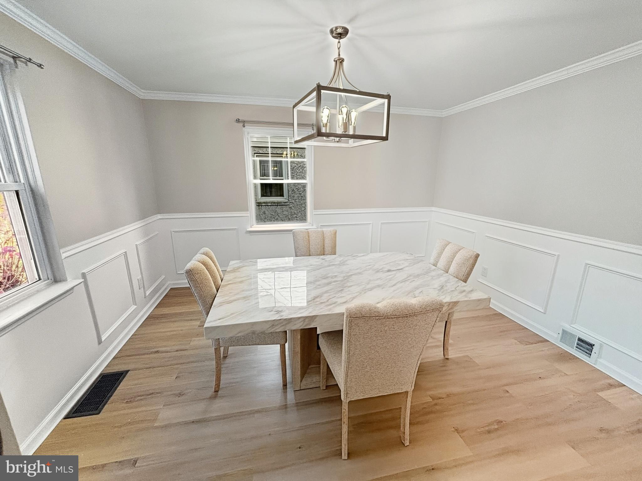 705 2nd Street Delanco, NJ 08075 - Photo 4 of 16 a dining room with furniture a chandelier and wooden floor
