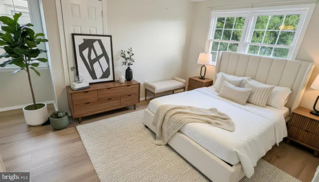 a bedroom with bed and balcony