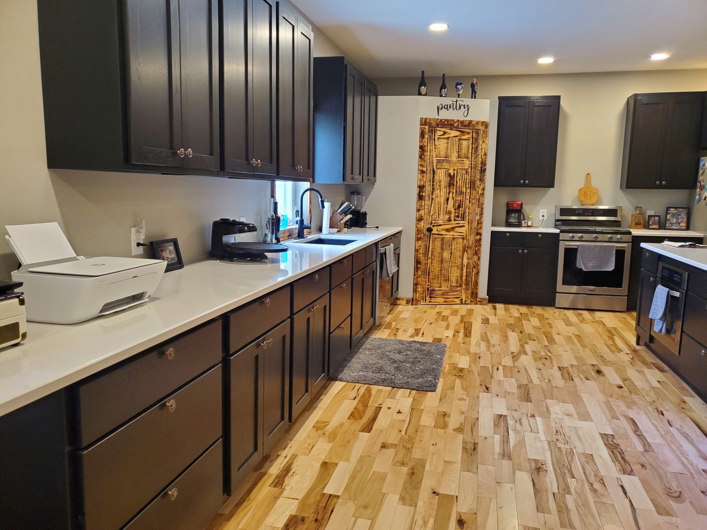 507 North Secor Street Gilman, IL 60938 - Photo 17 of 28 a kitchen with stainless steel appliances kitchen island granite countertop a sink refrigerator and cabinets