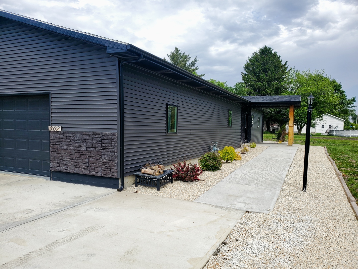 507 North Secor Street Gilman, IL 60938 - Photo 20 of 28 a view of a house with a patio