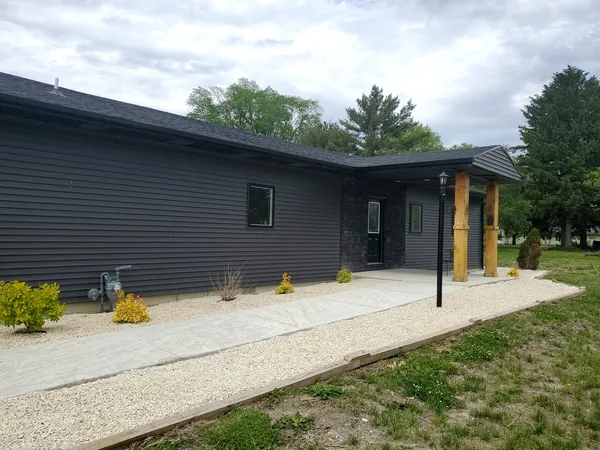 a house with trees in front of it
