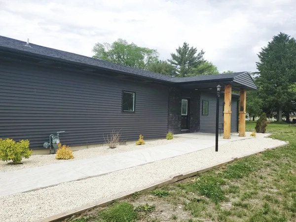 a view of a livingroom with furniture and a flat screen tv