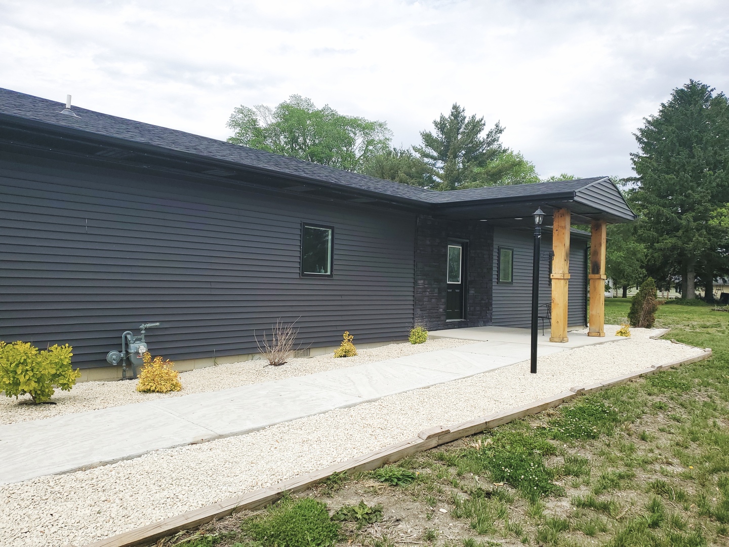 507 North Secor Street Gilman, IL 60938 - Photo 23 of 28 a house with trees in front of it
