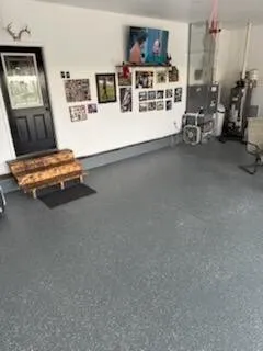 a large white kitchen with sink a refrigerator and chairs