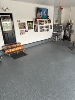 507 North Secor Street Gilman, IL 60938 - Photo 25 of 28 a view of a livingroom with furniture and a flat screen tv