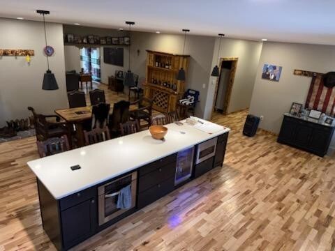 507 North Secor Street Gilman, IL 60938 - Photo 27 of 28 a large white kitchen with sink a refrigerator and chairs