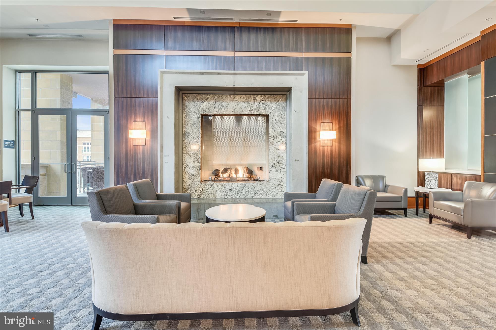 11990 Market Street, Unit 1017 Reston, VA 20190 - Photo 32 of 47 Well appointed common area - relax near the fire.
