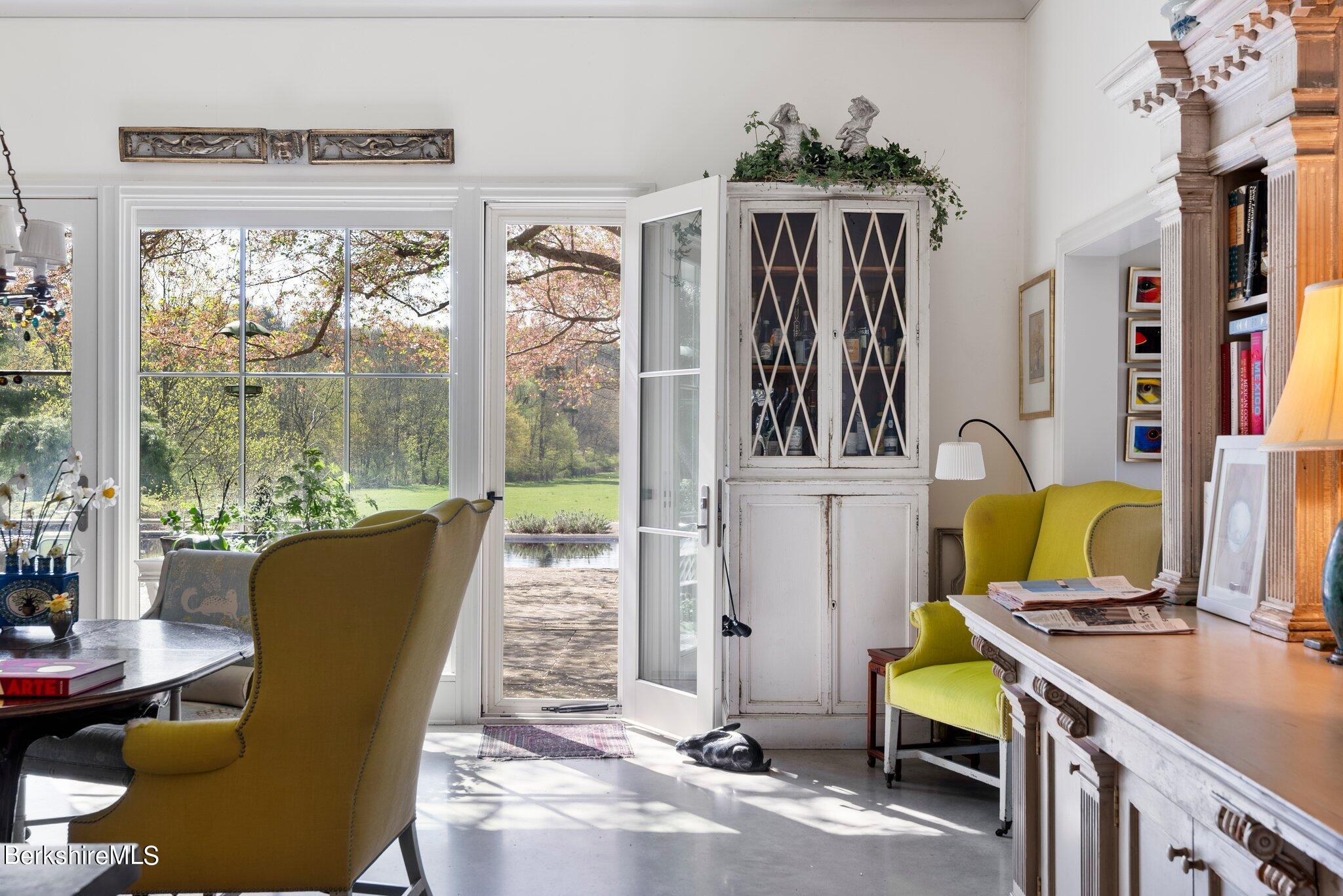 77 Seekonk Cross Road Great Barrington, MA 01230 - Photo 13 of 66 a view of a dining room with furniture window and outside view
