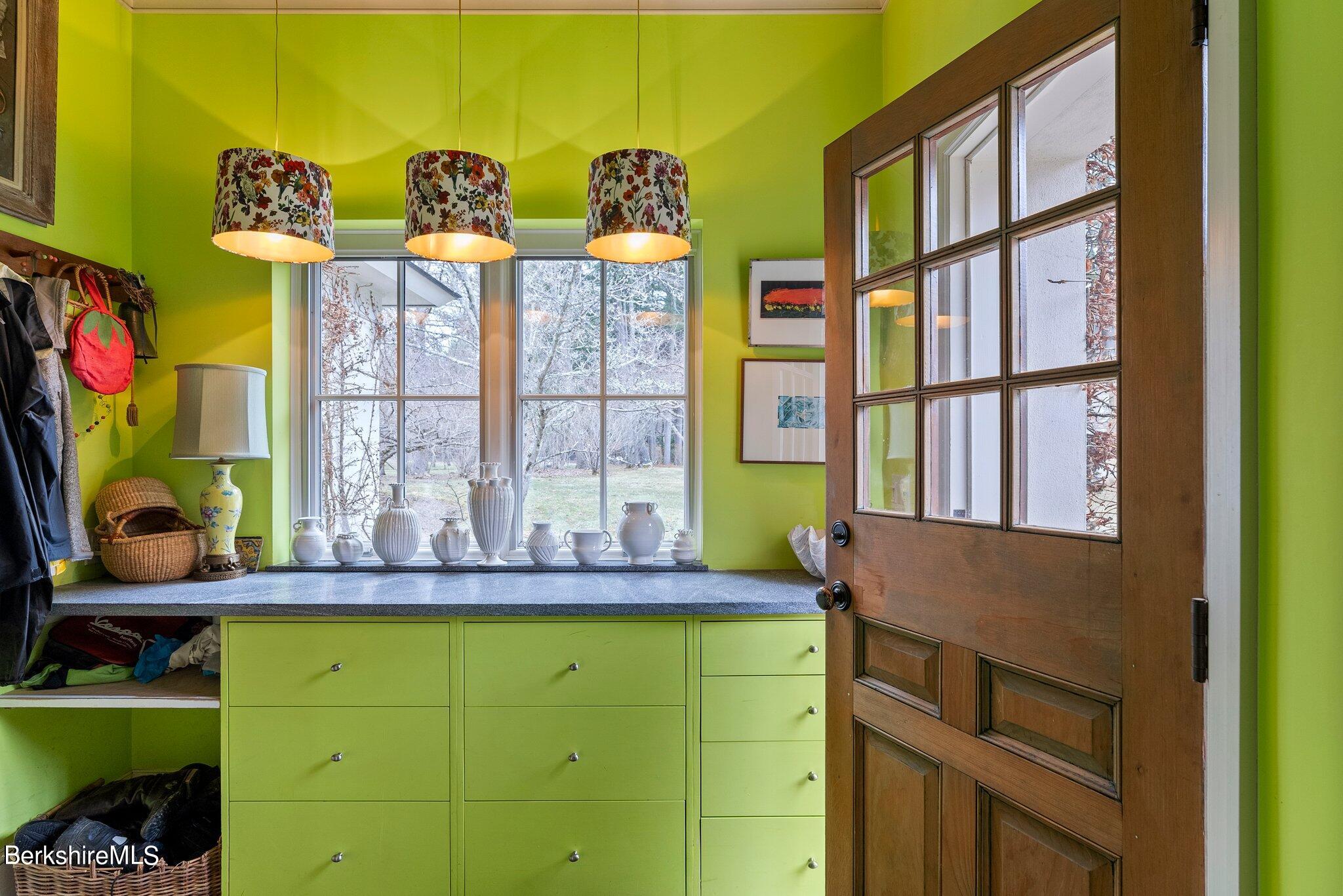 77 Seekonk Cross Road Great Barrington, MA 01230 - Photo 15 of 66 a bathroom with a granite countertop sink and a large mirror next to a window