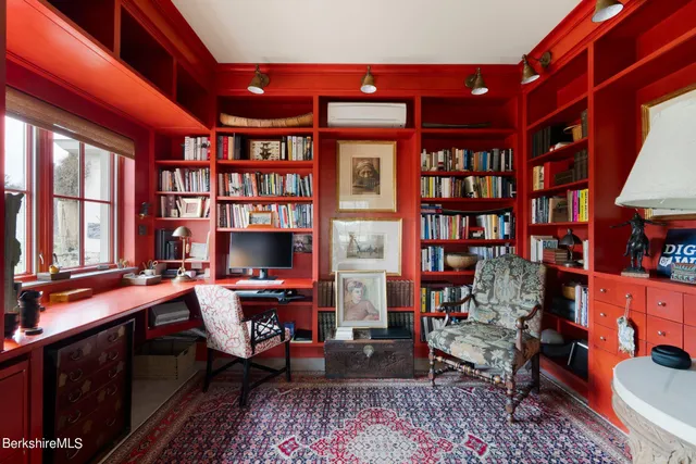 a living room with furniture a fireplace and flowers