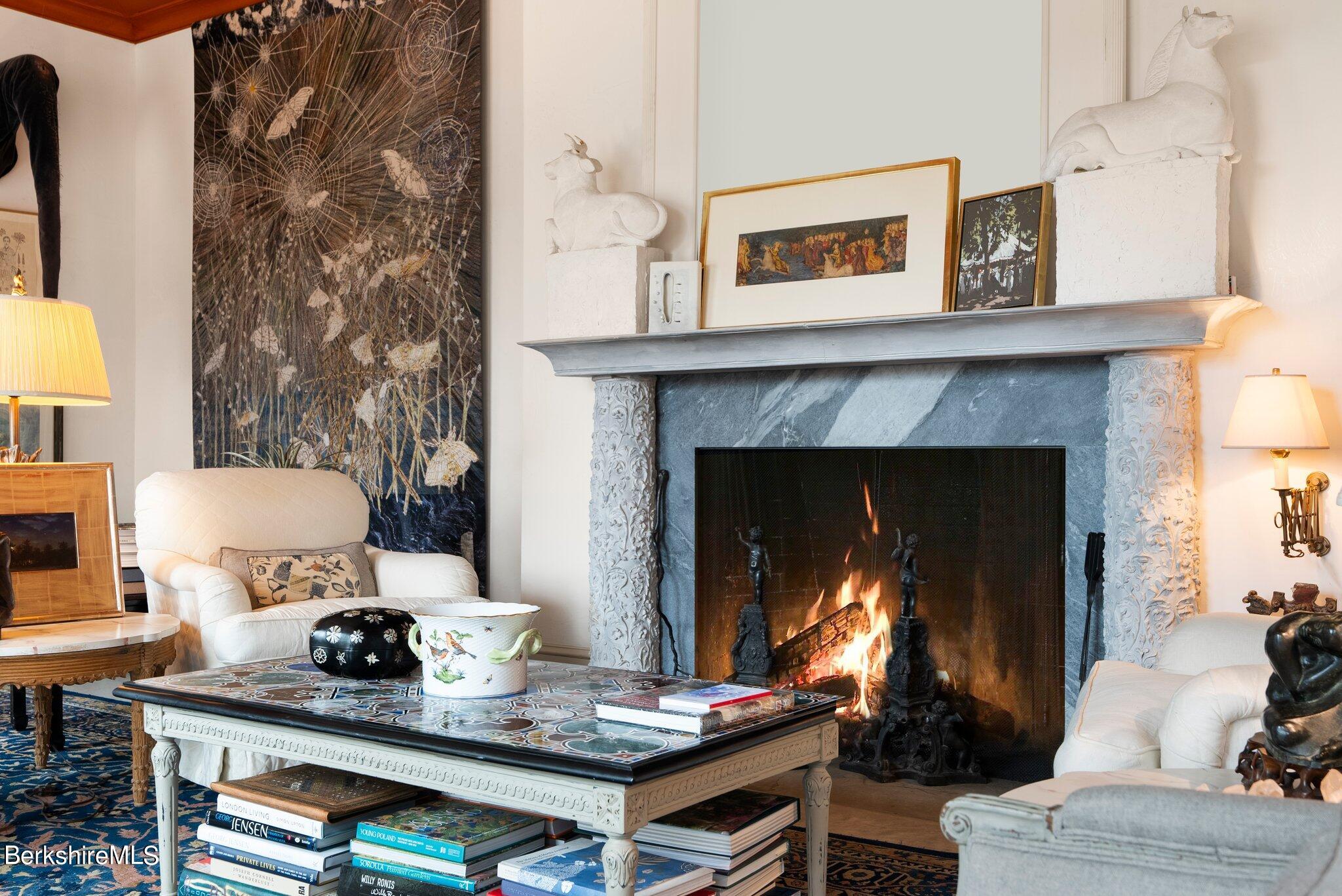 77 Seekonk Cross Road Great Barrington, MA 01230 - Photo 28 of 66 a living room with furniture and a fireplace