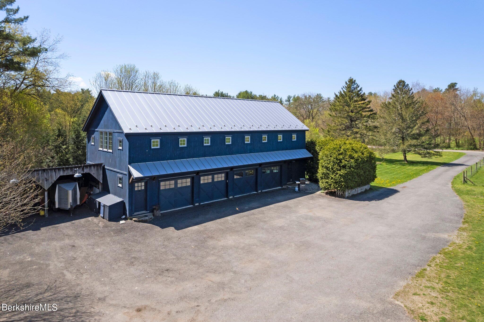 77 Seekonk Cross Road Great Barrington, MA 01230 - Photo 46 of 66 a view of a wooden deck and a backyard