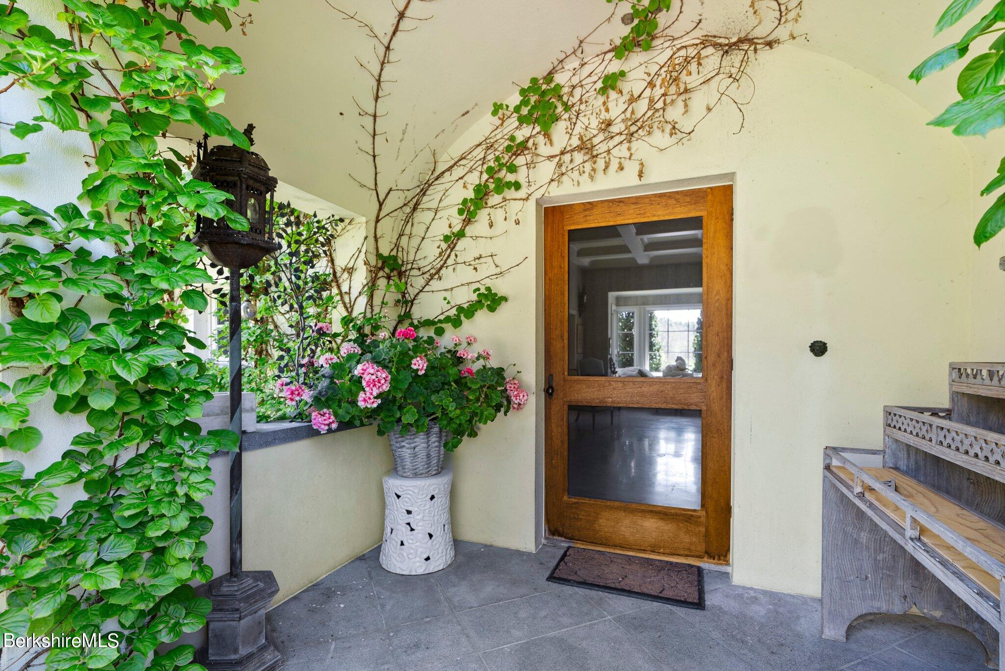 77 Seekonk Cross Road Great Barrington, MA 01230 - Photo 53 of 66 a house with a flower garden