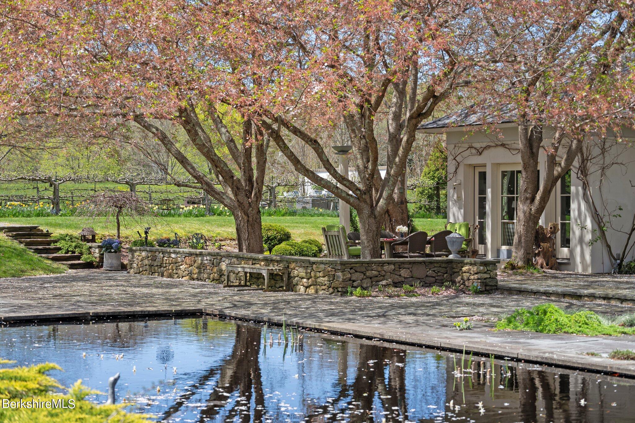 77 Seekonk Cross Road Great Barrington, MA 01230 - Photo 56 of 66 a backyard of a house with barbeque oven