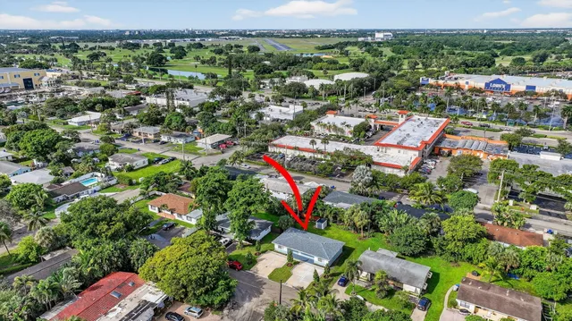 an aerial view of residential houses with outdoor space