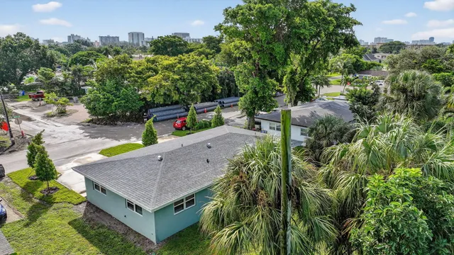 an aerial view of a house with a yard