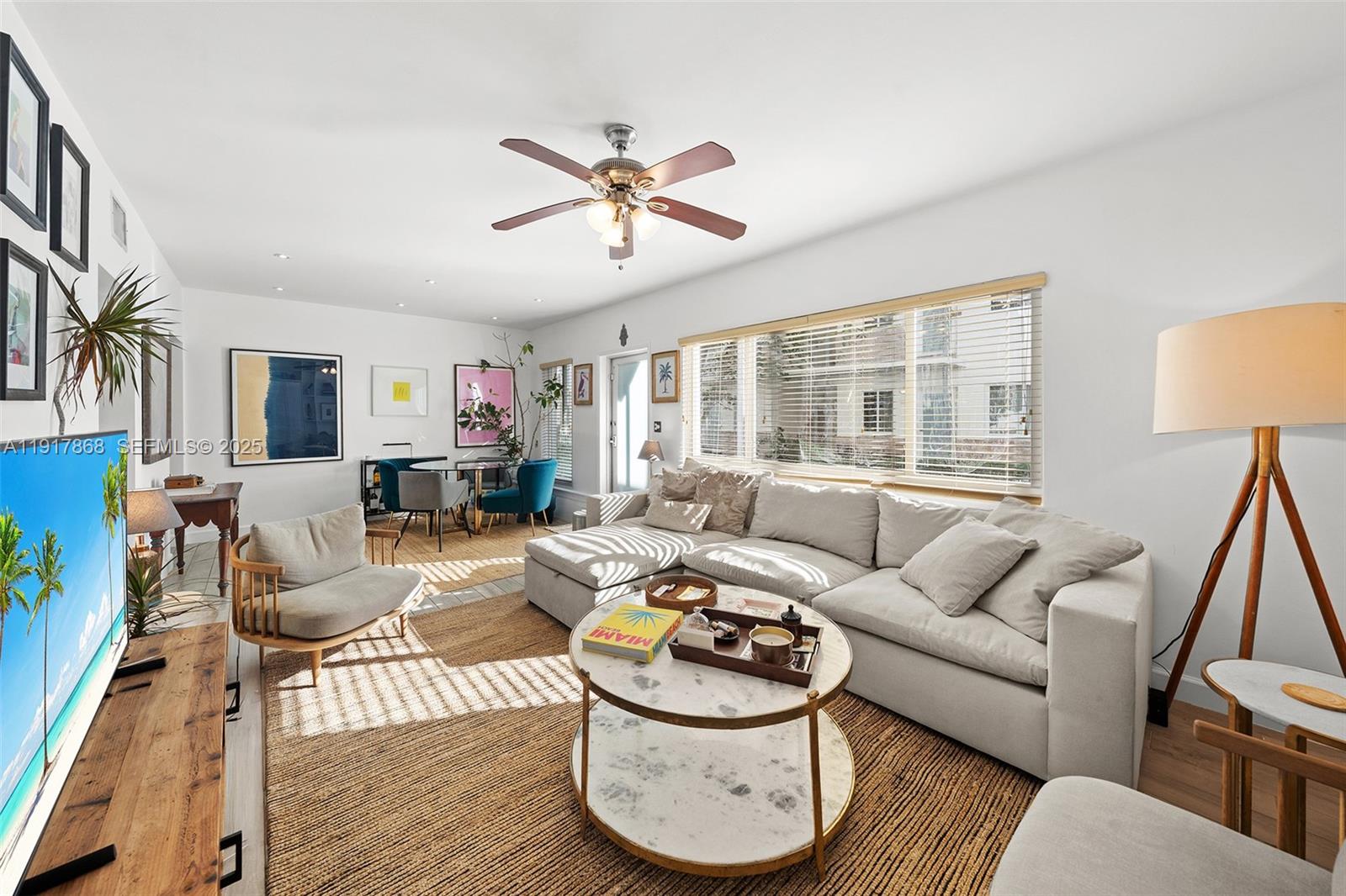 1120 Venetian Way, Unit 1D Miami, FL 33139 - Photo 3 of 11 a living room with furniture and a large window