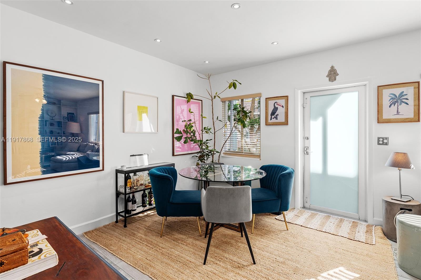 1120 Venetian Way, Unit 1D Miami, FL 33139 - Photo 4 of 11 a view of a livingroom with furniture and window