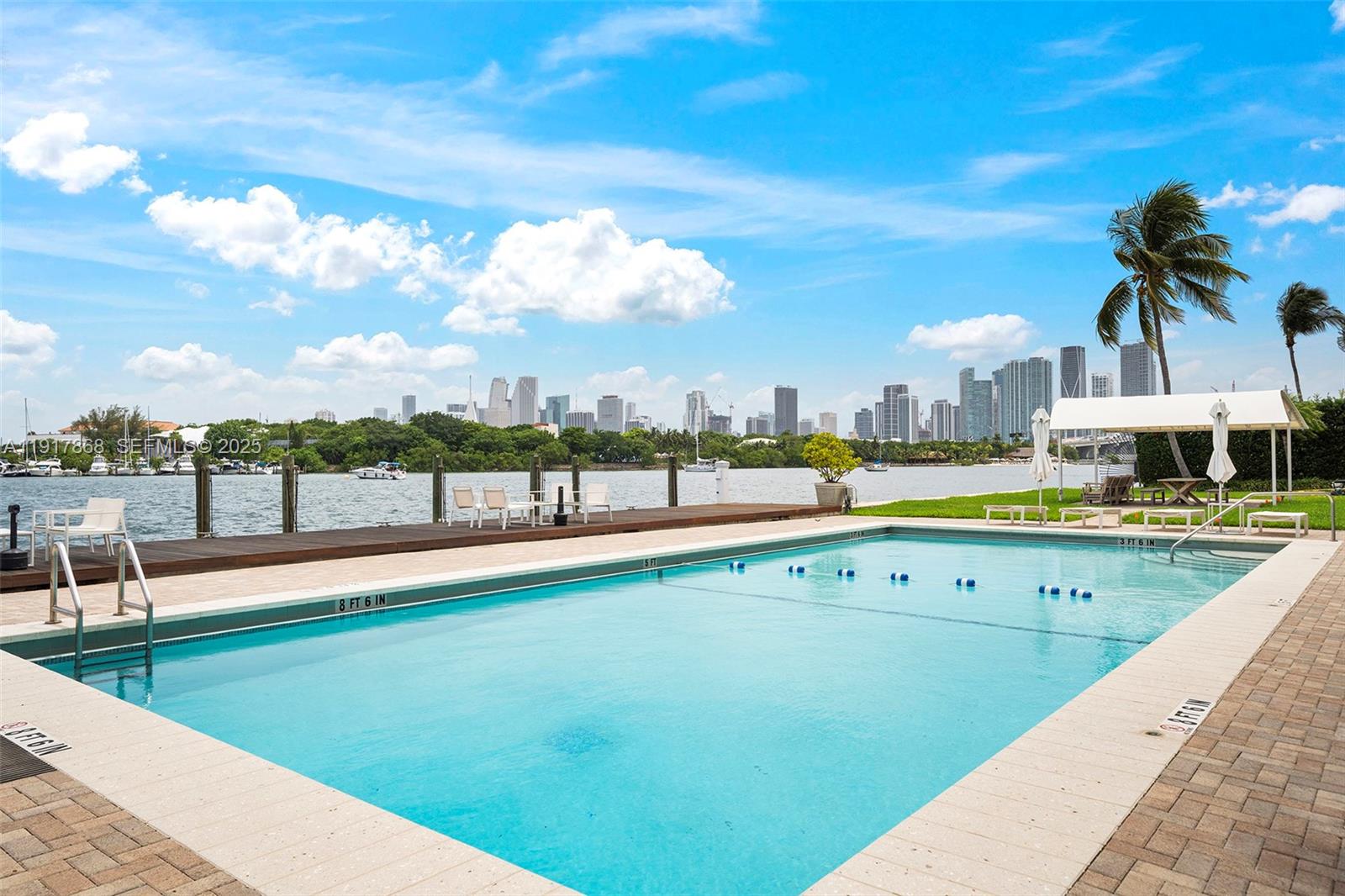 1120 Venetian Way, Unit 1D Miami, FL 33139 - Photo 8 of 11 a view of a swimming pool and a terrace