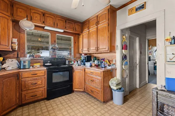 a kitchen with stainless steel appliances a stove sink and cabinets