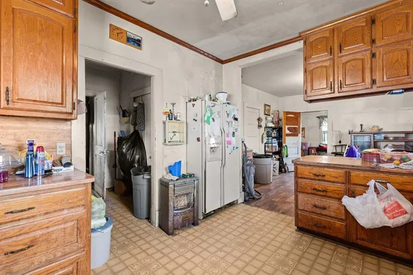 a bathroom with a toilet and a shower curtain