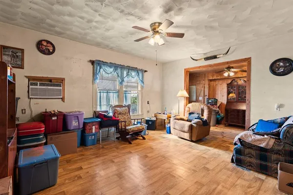 a room with furniture a rug and a window
