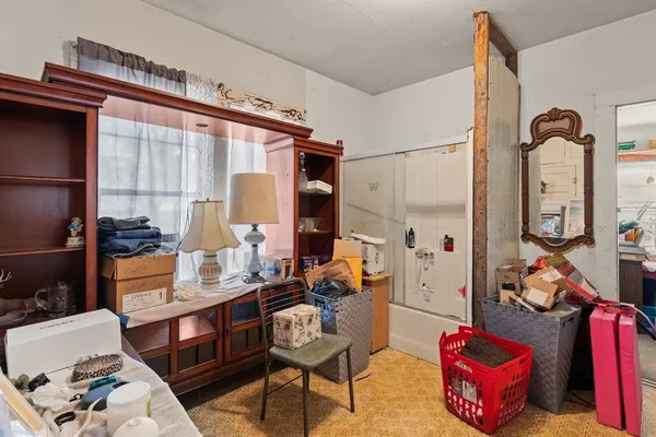 a living room with lots of furniture and a flat screen tv