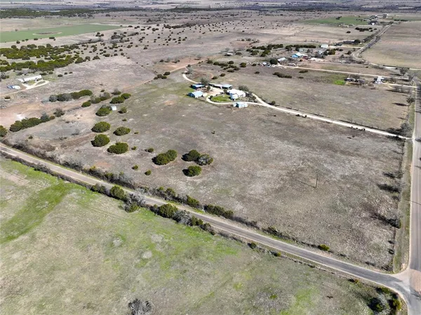 a view of a swimming pool with a yard